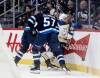 John Woods / THE CANADIAN PRESS
                                Winnipeg Jets&rsquo; Cole Koepke (left hidden) collides with Buffalo Sabres&rsquo; Beck Malenstyn (29) as Elias Salomonsson (57) looks on during first period NHL action in Winnipeg on Friday, December 5, 2025.