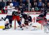 JOHN WOODS / THE CANADIAN PRESS
                                Winnipeg Jets goaltender Connor Hellebuyck (37) saves a shot as Luke Schenn (5) defends against Washington Capitals&rsquo; Brandon Duhaime (left) during the second period in Winnipeg on Saturday.