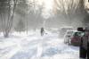 MIKAELA MACKENZIE / FREE PRESS
                                A Winnipeg man shovels out his car on Inglewood Street on Thursday.