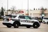 MIKAELA MACKENZIE / FREE PRESS A police car drives through retail parking lots in Unicity on Thursday, Nov. 6, 2025. For retail theft story. Free Press 2025