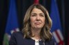 Premier Danielle Smith speaks to the media at the Legislature in Edmonton, on Wednesday, December 10, 2025. THE CANADIAN PRESS/Amber Bracken