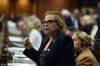 Minister of Immigration, Refugees and Citizenship Lena Diab rises during Question Period in the House of Commons on Parliament Hill in Ottawa on Thursday, Dec. 4, 2025. THE CANADIAN PRESS/Justin Tang