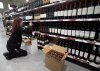 The Manitoba government is donating $2.6 million to charities in the province after selling off American-made liquor that was pulled from shelves in 2025. NLC employee Julie Spencer removes American products from the shelves of a Newfoundland Labrador Liquor Corporation (NLC) store in St John's on Monday, Feb. 3, 2025. THE CANADIAN PRESS/Paul Daly