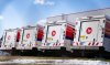 Canada Post trucks are seen in a distribution centre in Montreal on Dec. 13, 2024. THE CANADIAN PRESS/Christinne Muschi