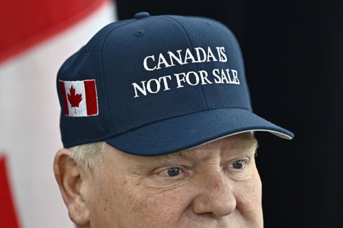 Ontario Premier Doug Ford, wearing a 'Canada Is Not For Sale' hat, speaks as he arrives for a first ministers meeting in Ottawa on Wednesday, Jan. 15, 2025. THE CANADIAN PRESS/Justin Tang