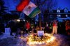 People gather for a vigil after an Immigration and Customs Enforcement officer shot and killed a woman earlier in the day, Wednesday, Jan. 7, 2026, in Minneapolis. (AP Photo/Bruce Kluckhohn)