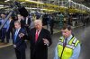 President Donald Trump speaks as Bill Ford, executive chairman of Ford, left, and Jim Farley, CEO of Ford, listen during a tour of the Ford River Rogue complex on Tuesday, Jan. 13, 2026, in Dearborn, Mich. (AP Photo/Evan Vucci)