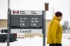 A person passes a Health Canada office at Tunney's Pasture, in Ottawa on Wednesday, Jan. 29, 2025. THE CANADIAN PRESS/Justin Tang