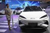 A model stands near a Sealion 7, an electric vehicle from Chinese automaker BYD, during the Gaikindo Indonesia International Auto Show in Tangerang, Indonesia on Wednesday, July 23, 2025. (AP Photo/Tatan Syuflana, File)