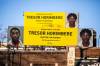 MIKAELA MACKENZIE / FREE PRESS FILES
                                Billboards display homicide suspect Tresor Horimbere on Portage Avenue (near Lipton Street) on Wednesday.