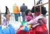 RUTH BONNEVILLE / FREE PRESS
                                Siblings Presley (from left), Tylee, and Shiela Robinson wait with their father and another community member for a transport vehicle to take them back to their hotel after picking up supplies in Winnipeg on Tuesday.