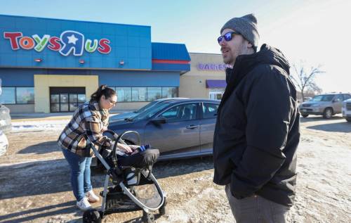 RUTH BONNEVILLE / FREE PRESS
                                Jordan Pastushenko, his wife Breanne and their nine-month-old son, Bohden, visited Toys &ldquo;R&rdquo; Us Wednesday morning after hearing of the store&rsquo;s upcoming closure.