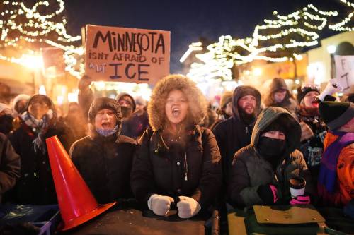 ADAM GRAY / THE ASSOCIATED PRESS
                                People demonstrate outside the Graduate by Hilton Minneapolis hotel, where it&rsquo;s believed ICE agents are staying.