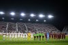 Canada, left, and Venezuela starting players line up for the national anthems in front of a near-empty stadium for an international friendly soccer match, Tuesday, Nov. 18, 2025, in Fort Lauderdale, Fla. (AP Photo/Rebecca Blackwell)