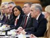 Premier of Saskatchewan Scott Moe, third from right, sits beside Canadian Prime Minister Mark Carney, second from right, as they take part in a bilateral meeting with Premier of China Li Qiang at the Great Hall of the People in Beijing, China on Thursday, Jan. 15, 2026. THE CANADIAN PRESS/Sean Kilpatrick