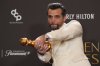 Wagner Moura poses in the press room with the award for best performance by a male actor in a motion picture – drama for 