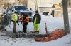Crews work to fix a water main break in front of a home on the Pimicikamak Cree Nation, Man., on Wednesday, Jan. 7, 2026. THE CANADIAN PRESS/John Woods