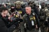 U.S. Border Patrol Cmdr. Gregory Bovino arrives as protesters gather outside the Bishop Henry Whipple Federal Building on Thursday, Jan. 8, 2026, in Minneapolis, Minn. (AP Photo/Tom Baker)