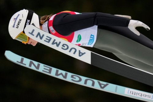 FILE - Annika Malacinski of the United States soars through the air during the women's individual compact NH 5km competition at the Nordic Combined World Cup in Ramsau, Austria, Saturday, Dec.16, 2023. (AP Photo/Matthias Schrader, File)