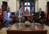 Prime Minister Mark Carney, right, speaks with Alberta Premier Danielle Smith, left, and B.C. Premier David Eby at the start of a meeting in the Prime Minister's Office in Ottawa, Wednesday, Jan. 28, 2026. THE CANADIAN PRESS/Adrian Wyld
