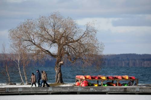 Visitors walk along the pier at the Clear Lake Marina in Wasagaming at Riding Mountain National Park. (Tim Smith / The Brandon Sun files)