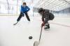JOHN WOODS / FREE PRESS
                                Sam Taylor, activity leader, helps young immigrants to Winnipeg during a day out skating at Camp Manitou in Headingley Sunday, February 8, 2026. reporter: Maggie