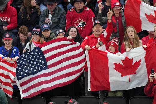 CAROLYN KASTER / THE ASSOCIATED PRESS
                                Fans cheer for their teams during the first period of the women&rsquo;s ice hockey gold medal game between the United States and Canada at the 2026 Winter Olympics, in Milan, Italy, Thursday, Feb. 19, 2026. (AP Photo/