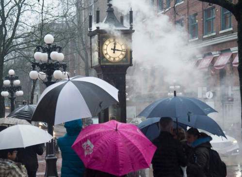 People walk by the steam clock in Gastown in downtown Vancouver, on Tuesday, Dec. 31, 2019. THE CANADIAN PRESS/Jonathan Hayward