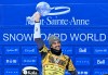 Eliot Grondin, of Sainte-Marie, Que., raises the Crystal Globe for the season’s overall winner, Sunday, April 6, 2025 at the FIS snowboard cross world cup event at Mont-Sainte-Anne resort in Beaupre, Quebec. THE CANADIAN PRESS/Jacques Boissinot