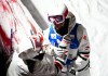 Mikael Kingsbury of Canada is comforted by his coach Michel Hamelin after a crash in the finals of the men's dual moguls freestyle ski world cup at Val Saint-Come, Que., on Saturday, Jan. 28, 2023. Kingsbury placed second. THE CANADIAN PRESS/Sean Kilpatrick