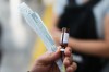 A health worker prepares a dose of the measles vaccine to give commuters at a subway station in Mexico City, Friday, Feb. 6, 2026. (AP Photo/Eduardo Verdugo)