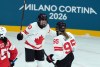 Canada’s Sarah Nurse (20) and Daryl Watts (95) celebrate a goal during the third period of a preliminary round women's hockey game at the Milan Cortina Winter Olympics, in Milan, on Saturday, Feb. 7, 2026. THE CANADIAN PRESS/Darryl Dyck