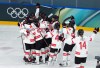 Canada celebrates their win over Switzerland during the preliminary round of the women's hockey game at the Milan Cortina Winter Olympics, in Milan, on Saturday, Feb. 7, 2026. THE CANADIAN PRESS/Darryl Dyck