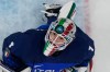 Italy's goalkeeper Gabriella Durante fails to save the puck as Japan's Akane Shiga scores her side's second goal during a preliminary round match of women's ice hockey between Japan and Italy at the 2026 Winter Olympics, in Milan, Italy, Monday, Feb. 9, 2026. (AP Photo/Hassan Ammar)