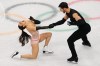 Laurence Fournier Beaudry and Guillaume Cizeron of France compete during the rhythm dance in figure skating at the 2026 Winter Olympics, in Milan, Italy, Monday, Feb. 9, 2026. (AP Photo/Francisco Seco)