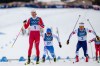 Johannes Hoesflot Klaebo, of Norway, left, Lauri Vuorinen, of Finland, and Ben Ogden, of the United States, right, cross the finish line in a semifinal of the cross-country skiing men's sprint classic at the 2026 Winter Olympics, in Tesero, Italy, Tuesday, Feb. 10, 2026. (AP Photo/Evgeniy Maloletka)