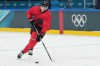 Canada's Connor McDavid skates with the puck during men's ice hockey practice at the 2026 Winter Olympics, in Milan, Italy, Sunday, Feb. 8, 2026. (AP Photo/Carolyn Kaster)
