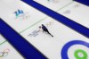 Bruce Mouat of Great Britain competes during the curling mix doubles bronze medal match at the 2026 Winter Olympics, in Cortina d'Ampezzo, Italy, Tuesday, Feb. 10, 2026. (AP Photo/Bernat Armangue)