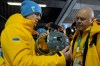 Ukrainian skeleton athlete Vladyslav Heraskevych left, holds his crash helmet at the mixed zone of the sliding center at the 2026 Winter Olympics, in Cortina d'Ampezzo, Italy, Thursday, Feb. 12, 2026. (AP Photo/Alessandra Tarantino)