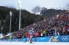 Adam Runnalls, of Canada, crosses the finish line in the men's 20-kilometer individual biathlon race at the 2026 Winter Olympics in Anterselva, Italy, Tuesday, Feb. 10, 2026. (AP Photo/David J. Phillip)