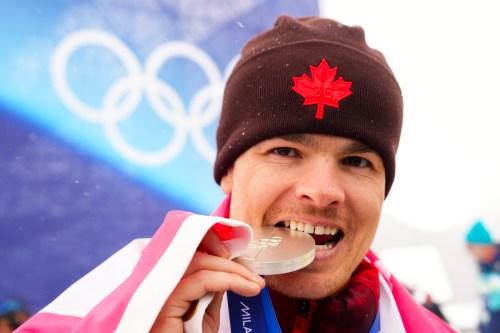 Mikael Kingsbury from Deux-Montagnes, Que., celebrates silver in the men's moguls at the Milano Cortina 2026 Winter Olympic Games in Livigno, Italy on Thursday, Feb. 12, 2026. THE CANADIAN PRESS/Sean Kilpatrick