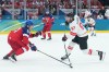 Connor McDavid (97) of Team Canada takes a shot as Radim Simek (51) of Team Czechia defends during second period men's Olympic hockey action at the 2026 Milan Cortina Winter Olympics in Milan, Italy on Thursday, February 12, 2026. THE CANADIAN PRESS/Nathan Denette