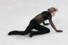 Ilia Malinin of the United States falls during the men's free skate program in figure skating at the 2026 Winter Olympics, in Milan, Italy, Friday, Feb. 13, 2026. (AP Photo/Francisco Seco)