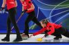 Canada's Rachel Homan in action during the women's curling round-robin session against Switzerland at the 2026 Winter Olympics in Cortina d'Ampezzo, Italy on Feb. 14, 2026. (AP Photo/Fatima Shbair)