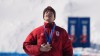 Gold medalist Canada's Mikael Kingsbury (4) celebrates after the men's freestyle skiing dual moguls finals at the 2026 Winter Olympics, in Livigno, Italy, Sunday, Feb. 15, 2026. (AP Photo/Gregory Bull)