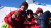 Canada's Mikael Kingsbury celebrates his gold medal in the men's freestyle skiing dual moguls with his partner Laurence Mongeon and son Henrik at the 2026 Winter Olympics, in Livigno, Italy, Sunday, Feb. 15, 2026. THE CANADIAN PRESS/Sean Kilpatrick