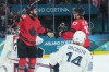 Tom Wilson (43) of Team Canada celebrates his goal with teammate Macklin Celebrini (17) as Stephane da Costa (14) of Team France looks on during first period Olympic hockey action at the 2026 Milan Cortina Winter Olympics in Milan, Italy on Sunday Feb. 15, 2026. THE CANADIAN PRESS/Nathan Denette