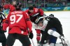 Canadian forward Tom Wilson (43) fights with French defenceman Pierre Crinon (7) at the 2026 Winter Olympics in Milan on Sunday, Feb. 15, 2026. THE CANADIAN PRESS/Nathan Denette