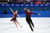 Canada's Lia Pereira and Trennt Michaud compete during the pairs short program figure skating event at the 2026 Winter Olympics, in Milan, on Sunday, Feb. 15, 2026. THE CANADIAN PRESS/Darryl Dyck