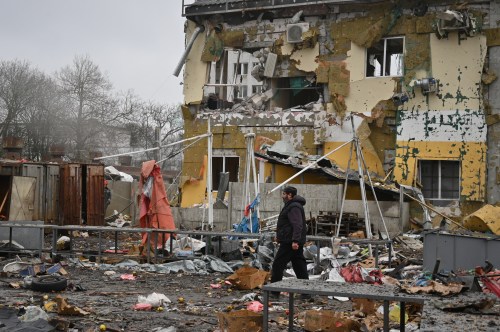A man walks at a ruined city market following a Russia's attack in Odesa, Ukraine, Thursday, Feb. 12, 2026. (AP Photo/Michael Shtekel)